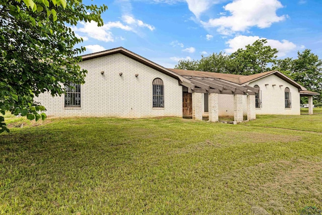 view of home's exterior with a yard