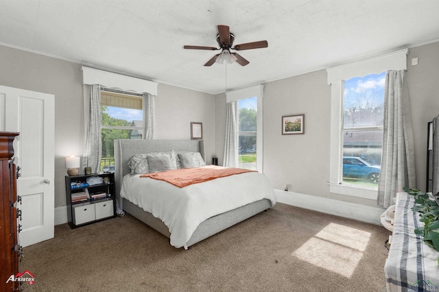 102 Poplar St, Marshall, TX 75670 - carpeted bedroom with multiple windows, ceiling fan, and ornamental molding