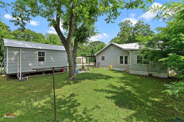 102 Poplar St, Marshall, TX 75670 - view of green lawn with an outdoor structure