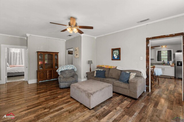 102 Poplar St, Marshall, TX 75670 - living room featuring ceiling fan, dark wood-style flooring, and ornamental molding