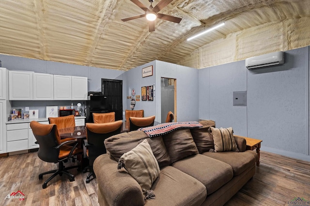 102 Poplar St, Marshall, TX 75670 - living room featuring a wall unit AC, wood finished floors, a ceiling fan, vaulted ceiling, and an office area