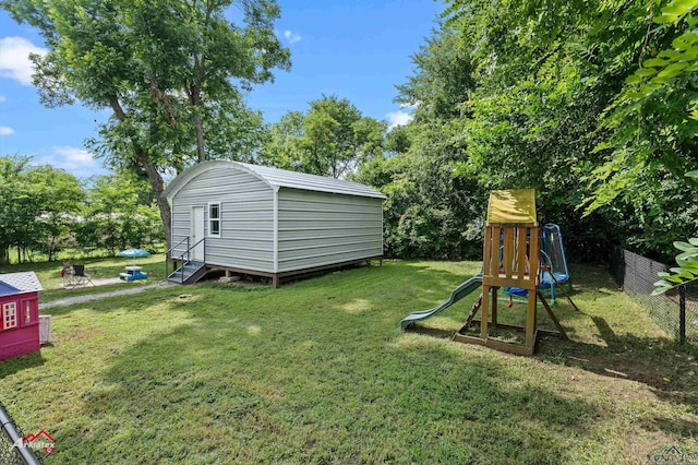 102 Poplar St, Marshall, TX 75670 - view of yard with an outdoor structure and a playground