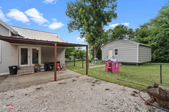 102 Poplar St, Marshall, TX 75670 - view of yard featuring french doors, a patio area, and entry steps