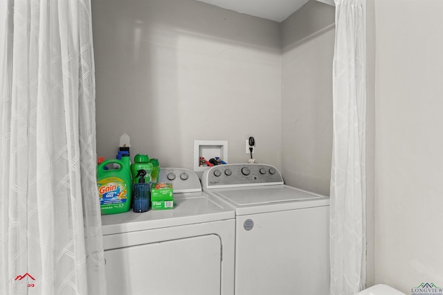 102 Poplar St, Marshall, TX 75670 - laundry area with washing machine and dryer