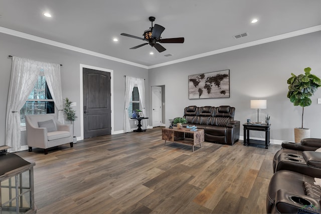 living room with hardwood / wood-style flooring, ornamental molding, and ceiling fan