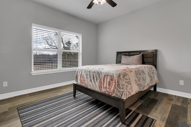 bedroom featuring dark hardwood / wood-style floors and ceiling fan