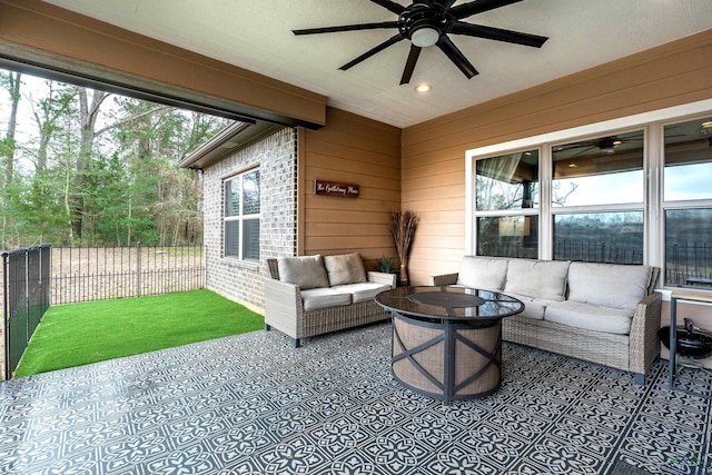 view of patio / terrace featuring an outdoor living space with a fire pit and ceiling fan