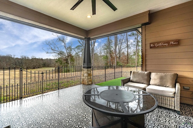 exterior space featuring ceiling fan