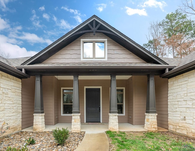 property entrance featuring covered porch