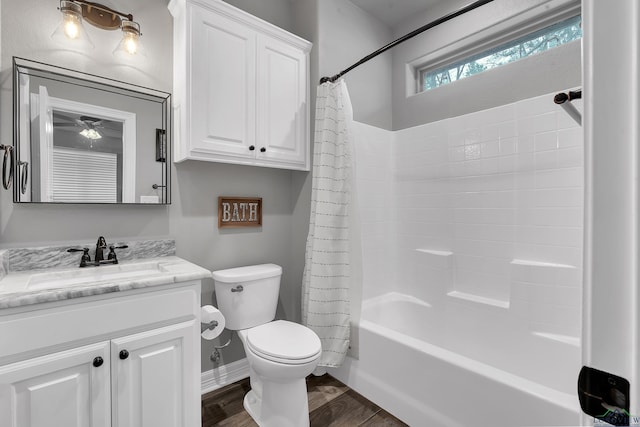 full bathroom featuring shower / bathtub combination with curtain, vanity, hardwood / wood-style flooring, and toilet