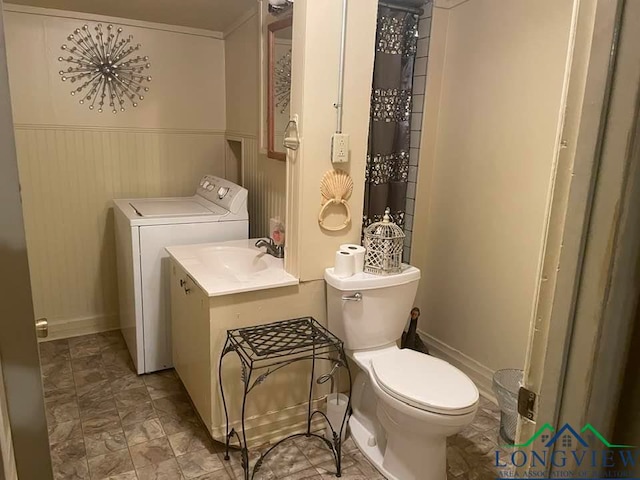 bathroom featuring wooden walls, sink, and toilet