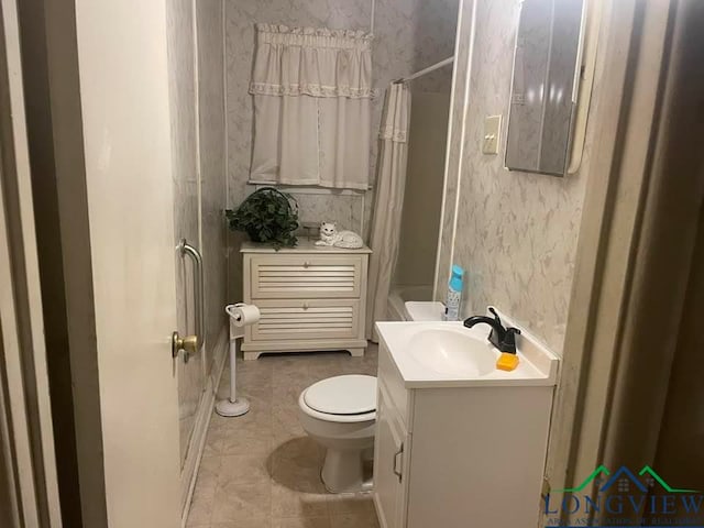 bathroom with tile patterned floors, vanity, and toilet