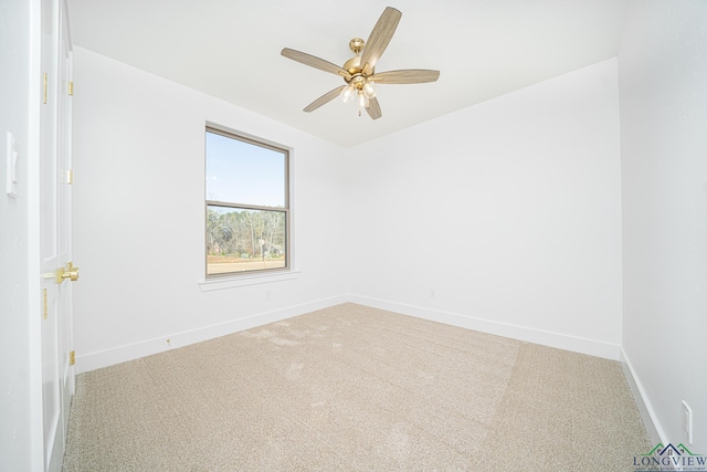 empty room featuring carpet flooring and ceiling fan