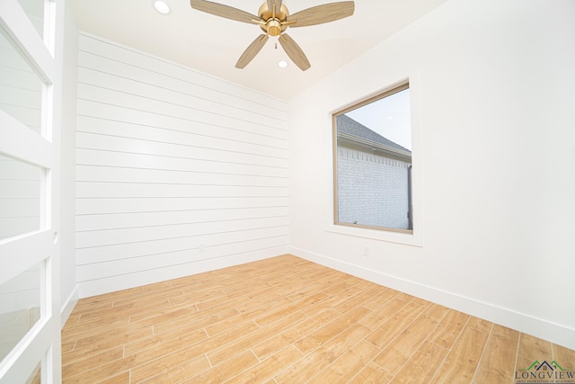 spare room featuring hardwood / wood-style flooring and ceiling fan