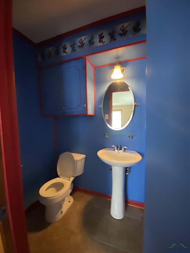 bathroom with tile patterned flooring and toilet