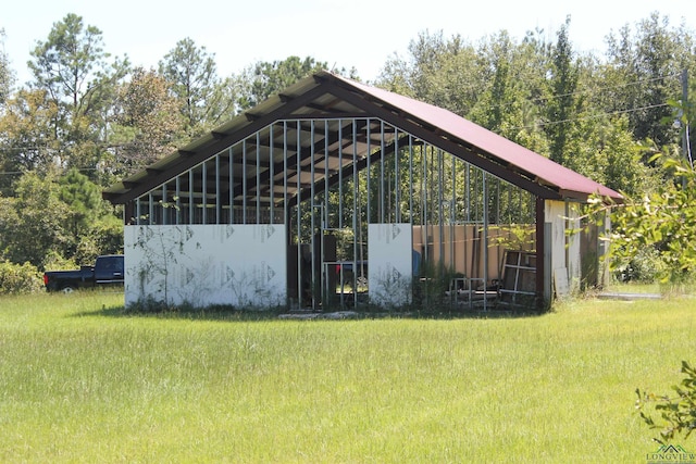 view of outbuilding with a lawn