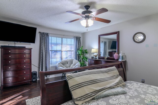 1317 Tiffany Ln, Longview, TX 75604 - bedroom featuring wood finished floors, a textured ceiling, and ceiling fan