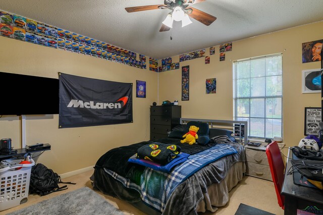1317 Tiffany Ln, Longview, TX 75604 - carpeted bedroom with a ceiling fan and a textured ceiling
