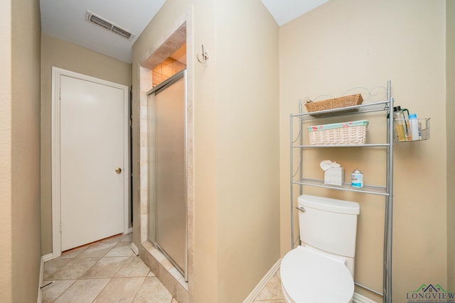 full bath with visible vents, toilet, a stall shower, tile patterned flooring, and baseboards