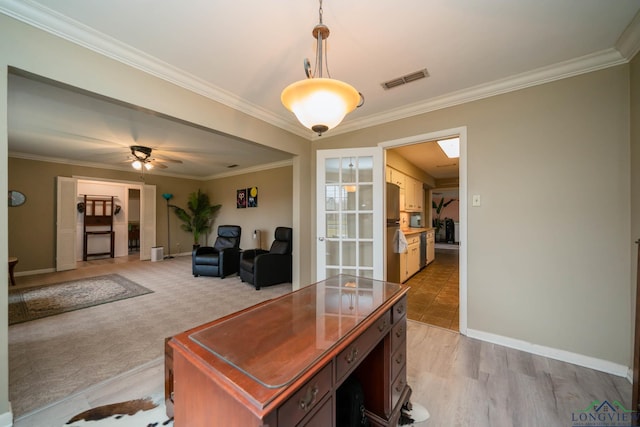 home office with visible vents, baseboards, ceiling fan, and crown molding