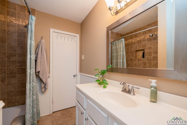 bathroom with tile patterned floors and vanity