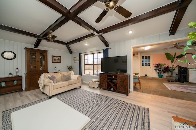 living room featuring beam ceiling, light wood-style flooring, and a ceiling fan