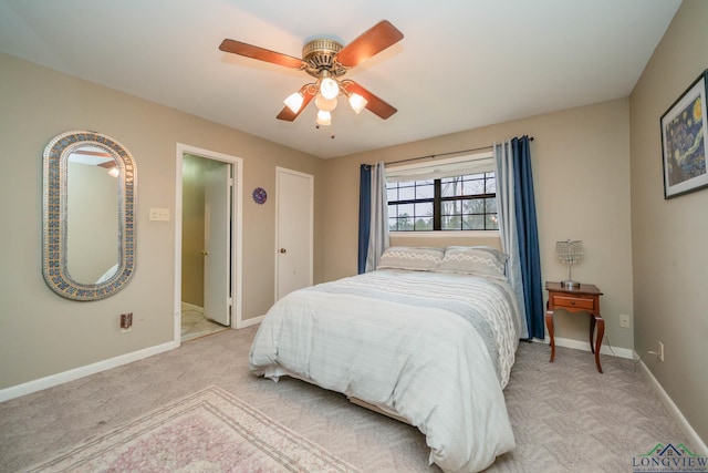 bedroom with baseboards, light colored carpet, and ceiling fan