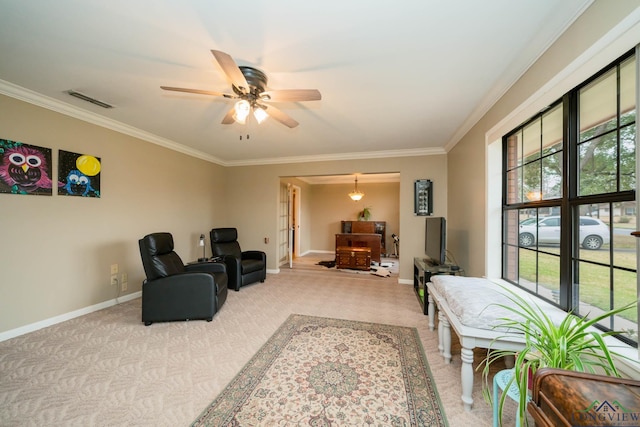 sitting room featuring crown molding, baseboards, visible vents, and light carpet