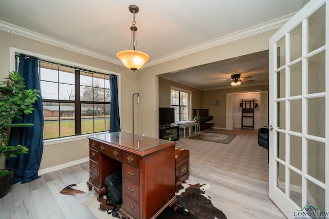 office area featuring ceiling fan, light wood-type flooring, baseboards, and ornamental molding