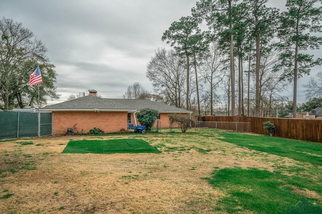 view of yard with a fenced backyard