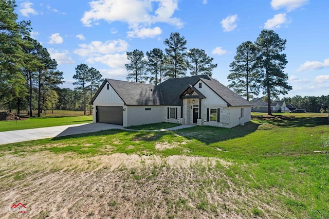 view of front of property featuring a garage and a front lawn