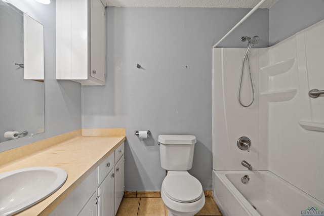 full bathroom with tile patterned flooring, bathing tub / shower combination, a textured ceiling, toilet, and vanity