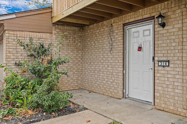 entrance to property with a balcony