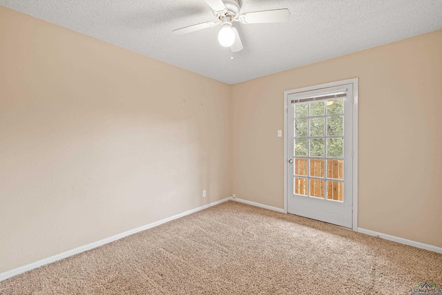 spare room with carpet flooring, a textured ceiling, and ceiling fan