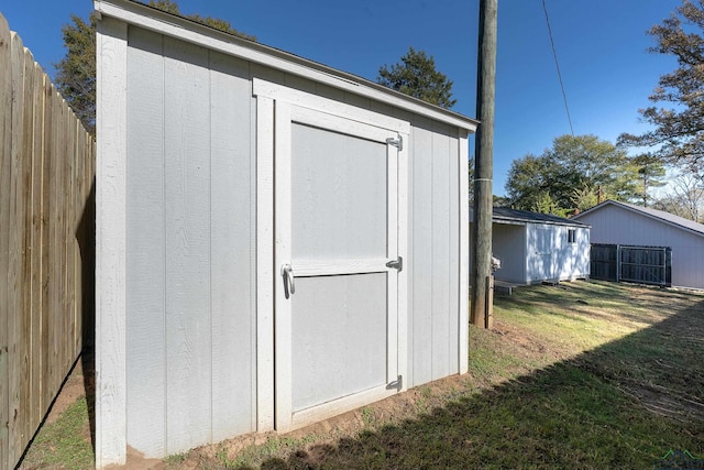 view of outbuilding with a yard