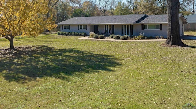 ranch-style house with a front lawn