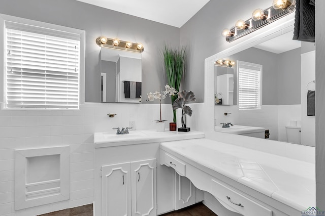 bathroom with tile patterned floors, vanity, and toilet