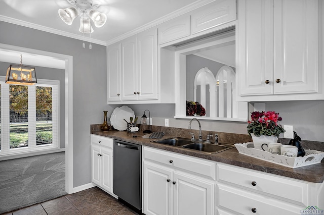 kitchen with dark tile patterned flooring, dishwasher, white cabinetry, and sink