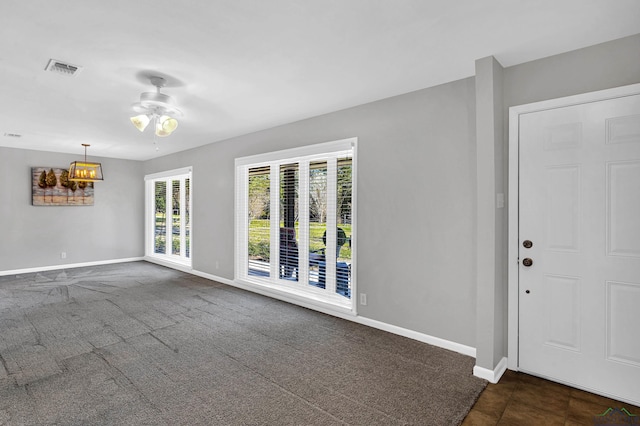 interior space featuring ceiling fan