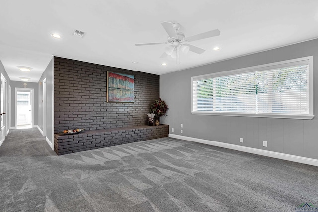 unfurnished living room with carpet floors and ceiling fan