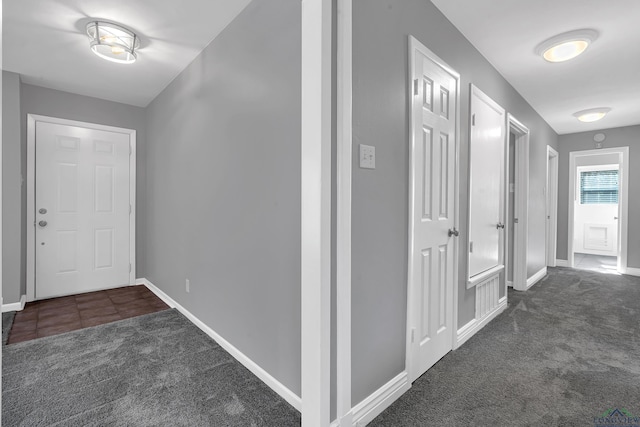 hall with dark carpet