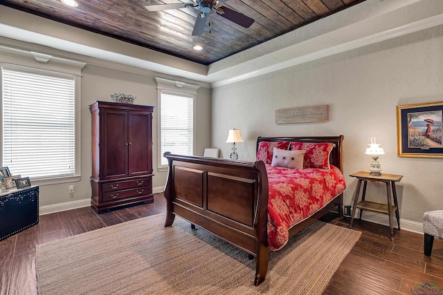 1624 Olympic Dr, Longview, TX 75605 - bedroom with baseboards, a raised ceiling, dark wood-style floors, wood ceiling, and ceiling fan