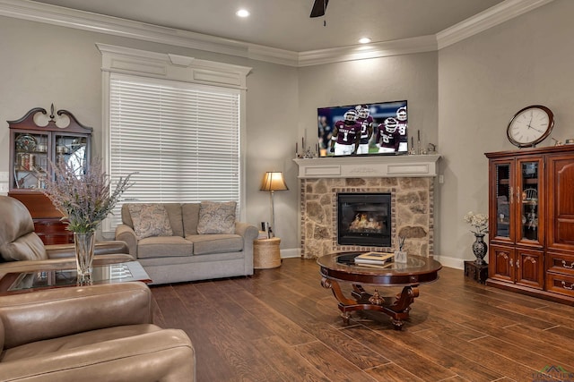 1624 Olympic Dr, Longview, TX 75605 - living area featuring wood finished floors, ceiling fan, a stone fireplace, crown molding, and recessed lighting