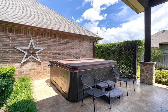 1624 Olympic Dr, Longview, TX 75605 - view of patio featuring a hot tub