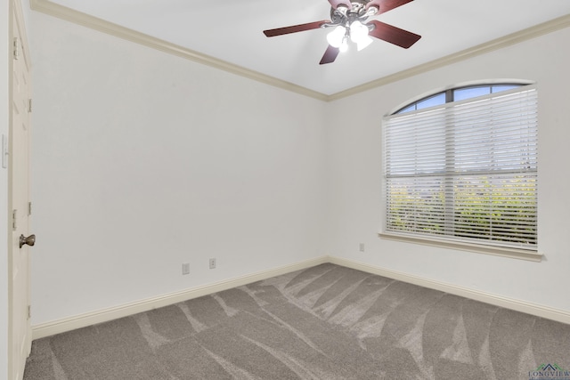 carpeted spare room with ceiling fan, baseboards, and ornamental molding