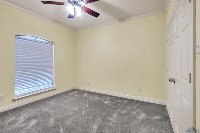 unfurnished room with ceiling fan, carpet, and ornamental molding