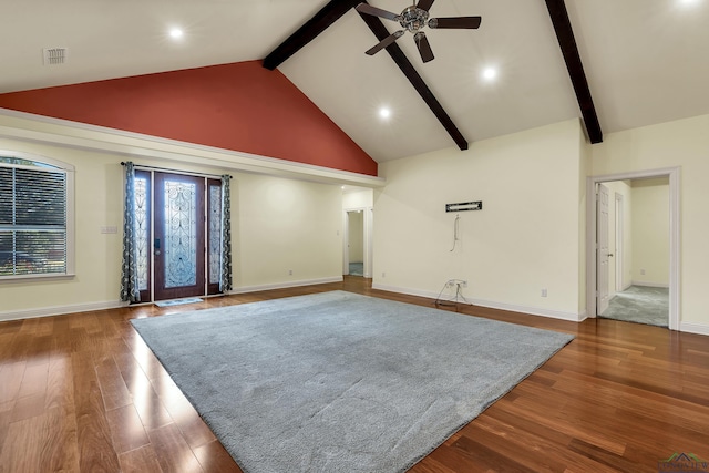 empty room with beam ceiling, dark hardwood / wood-style flooring, high vaulted ceiling, and ceiling fan