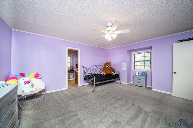 bedroom with ceiling fan, a textured ceiling, crown molding, and carpet flooring