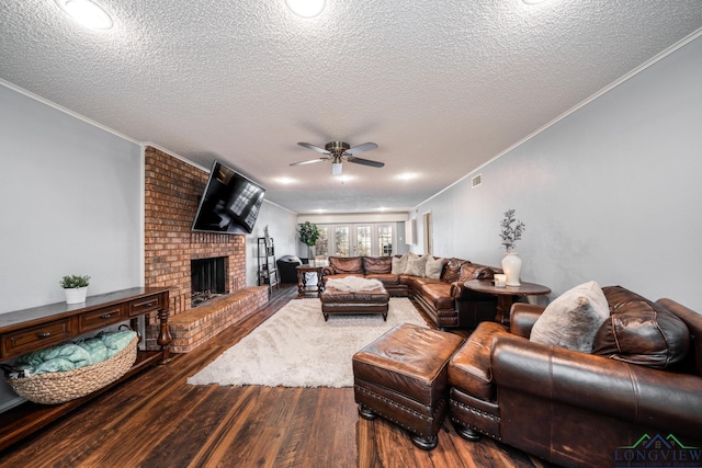 living room featuring a textured ceiling and crown molding