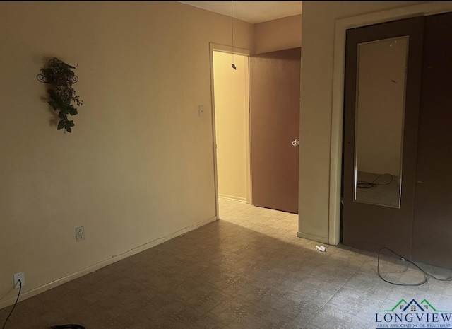 305 E Maple St, White Oak, TX 75693 - unfurnished room featuring tile patterned floors and baseboards